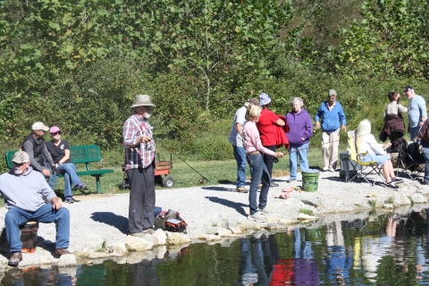 Anglers bank fishing trout stream