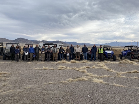 line of people in front of UTVs