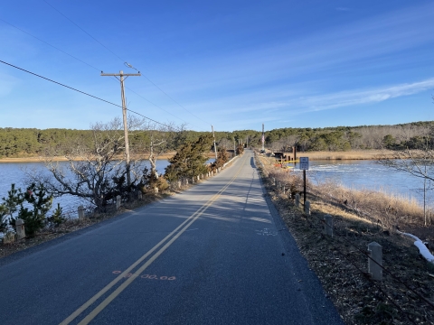 A road crossing water in a coastal area