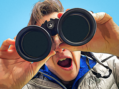 The author of the blog, Lev Levy, looking at the camera through binoculars.