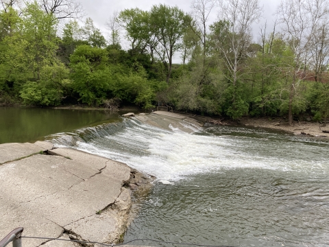 An aging concrete sloped dam