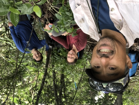 James Kwon in the forest with two other people