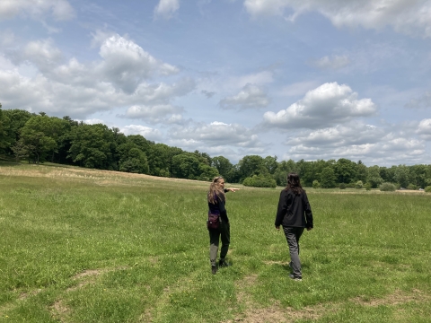 Mary Pelletier shows Service employee Chelsi Burns a large meadow in Keney Park