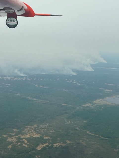 view from an airplane of a smoke filled sky 