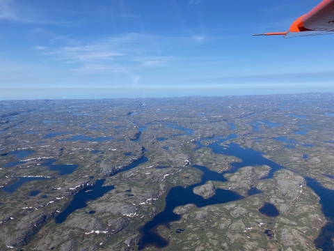 aerial view of water and a rocky landscape