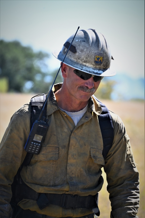 Carl Schwope walks toward the camera in his fire gear.