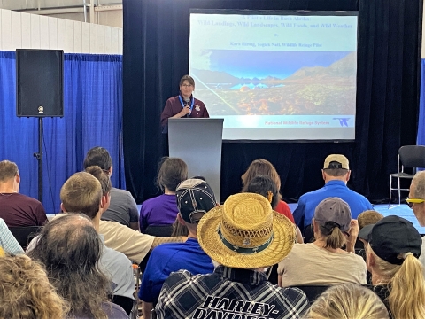 Kara Hilwig presents to audience at EAA AirVenture