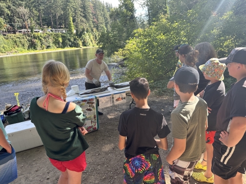 A Service hatchery manager conducts a fish dissection