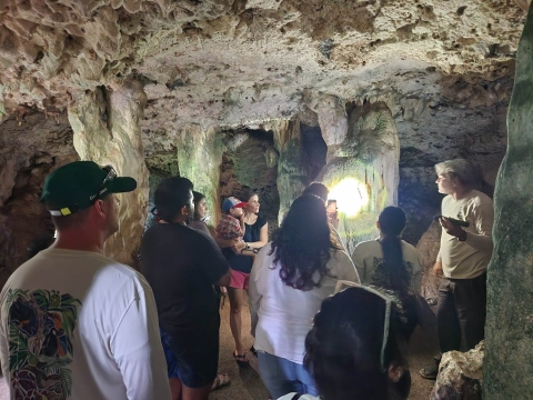 USFWS staff show visitors ancient CHamoru pictographs at Ritidian