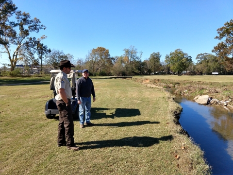 Jeffrey Drummond working with landowner at Roebuck Springs