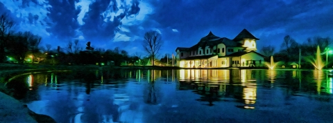 Dusk at the hatchery with the visitor center lights reflecting in the pond