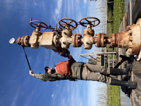 Service employee examines standing pile line. 