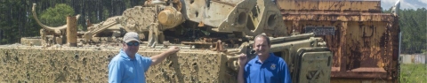 A tank littered with bullet holes at Townsend bombing range.