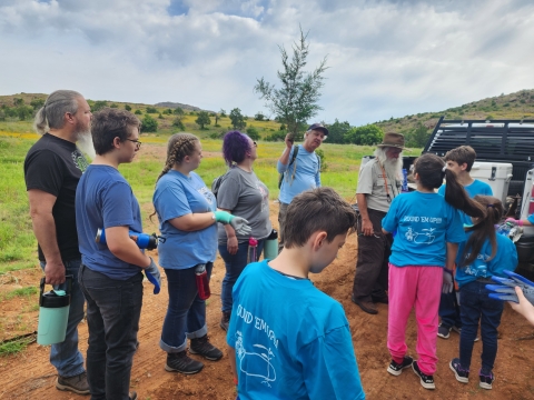 Kids listening to an outdoor talk