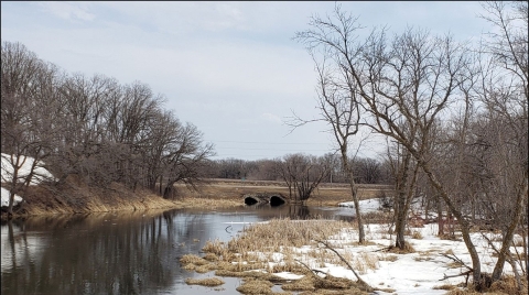 a river with a bridge over it