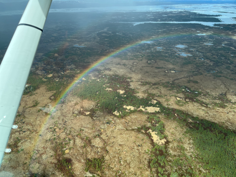 aerial view of a rainbow over the landscape