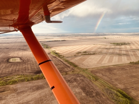 aerial view of a rainbow over the landscape