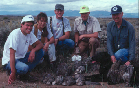 Marilet Zablan and others take a group photo over grouse that were hunted.
