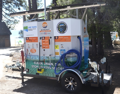 A mobile cleaning station sits near a thicket of trees at Meeks Bay Resort in Tahoma, Calif. 