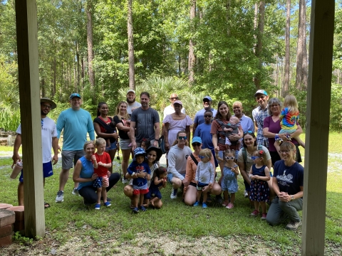 Group photo of participants in the St. Marks MWR Tots on Trails program. Photo includes parents and tots.