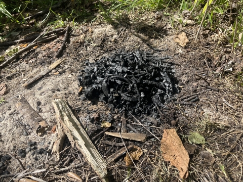 Discarded charcoal abandoned along the beach at Guam National Wildlife Refuge