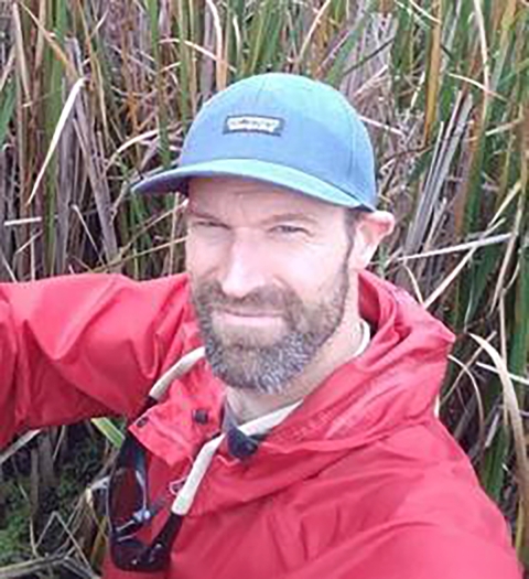 Photo of Matt Cooper in cattails