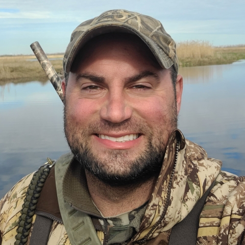 Randy Knapik in wetland dress in camo