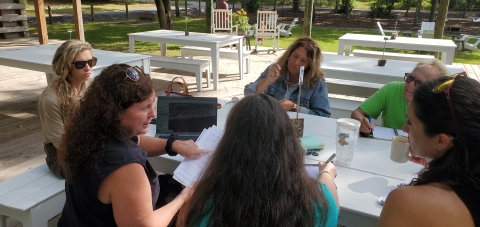 U.S. Fish and Wildlife Service biologist Shannon Holbrook meets with city officials and volunteers to discuss retrofitting lights for nesting sea turtles