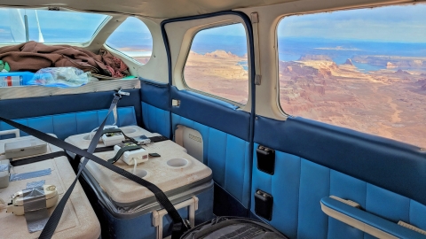 Ice chests containing woundfin with aerators inside plane mid flight.