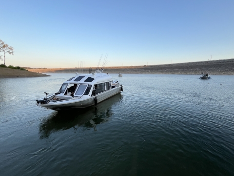 A fishing boat stationary on a lake