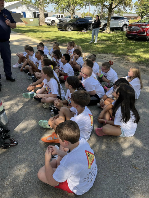 Students listening to a speaker