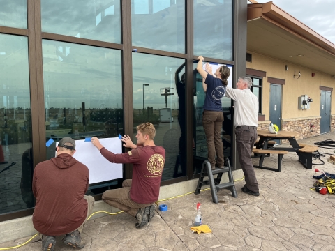 ACE Interns and RMA Staff install Bird Safe Glass at RMA NWR