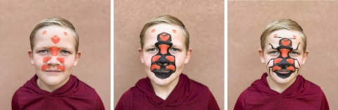 three images of a blond child showing the progression through steps to create an American burying beetle face paint look.