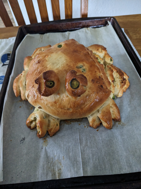 A loaf of jalapeno cheddar bread in the shape of a California red-legged frog