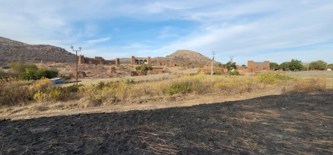 The Holy City, located within Wichita Mountains Wildlife Refuge, with charred black grass in the foreground. 