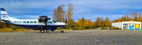 a plane on a gravel runway