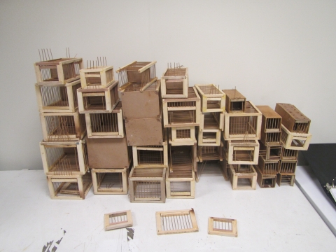 A stack of small wooden cages 