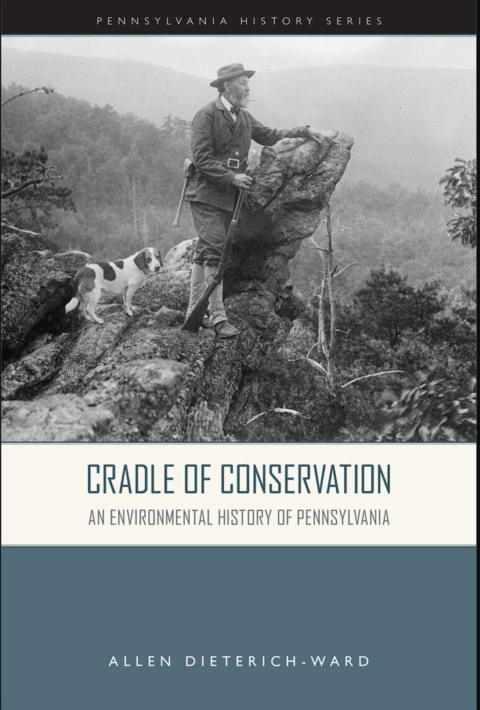 Cradle of Conservation book cover showing conservationist standing on large rock with dog by side.