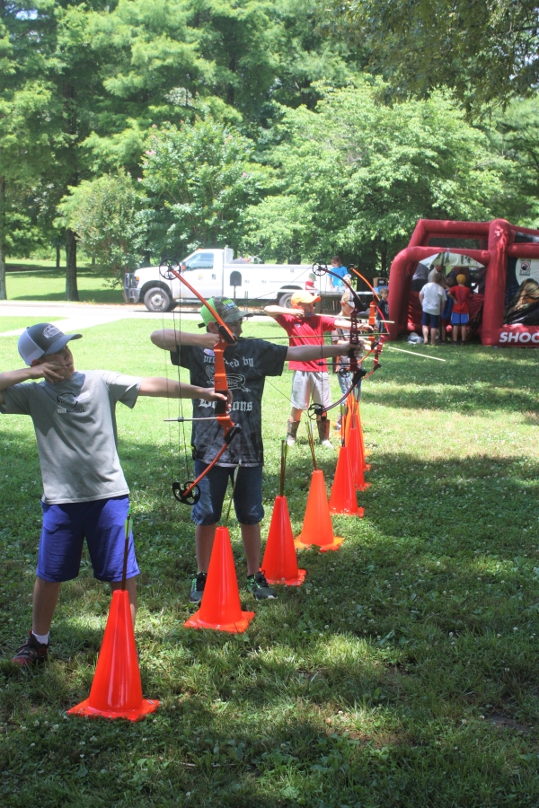 An image of children shooting bows and arrows.