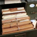 Bundled files in an old filing cabinet.