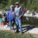 Senior couple smiling with a stringer full of Rainbow trout