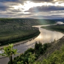 Landscape view of a river and boreal forest