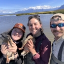 three people smiling, 2 are holding ducks