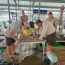 Norfork National Fish Hatchery and Arkansas Game and Fish emplyees sifting through sand in search of mussels.