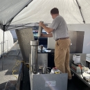 Staff from the NC Wildlife Resources Commission placing trout eggs into a pressurization chamber.