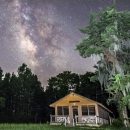 A cabin under a stary sky
