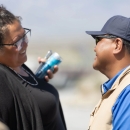 Two people smile at each other