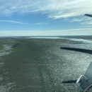 aerial view of airplane over a lake