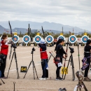 Five archers line up to shoot targets at the Arizona Cup. 