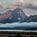 Clouds surround the major peaks of the Teton Range over Jackson Lake and Willow Flats.